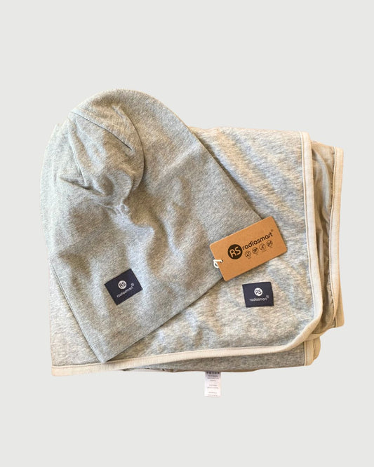 Embrace wellness with the Radia Smart® BUNDLE DEAL EMF Protection Poncho and Slouch Beanie in Grey. Silver-lined with Faraday fabric, this set blocks EMF, RF, and 5G radiation, supporting fertility and overall health. Made from soft, breathable materials, the poncho and beanie offer stylish comfort and powerful shielding. Perfect for daily wear, this bundle provides peace of mind and protection from modern wireless exposure.