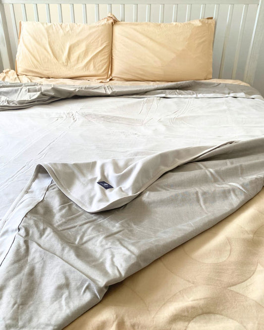 Stay cozy and protected with the Radia Smart® Mega Large EMF Protection Bed Blanket in Grey. Made from 100% cotton and silver-lined Faraday fabric, it blocks EMF, RF, and 5G radiation for a safer sleep environment. This breathable, soft bed blanket doubles as a bed sheet, offering full-body coverage and comfort while reducing wireless exposure. Ideal for promoting restful sleep and overall wellness in today’s connected world.