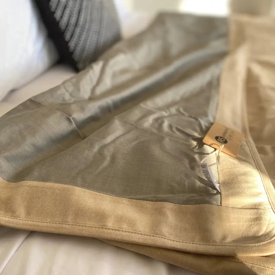 Stay cozy and protected with the Radia Smart® Classic XL Organic Cotton Bed Blanket. Crafted with silver-lined Faraday fabric, it provides powerful EMF protection by shielding against RF and 5G radiation. This extra-large, breathable, and soft blanket supports restful sleep and overall wellness. Ideal for daily use, it offers full-body coverage and reduces exposure to wireless signals in a natural, organic, and comfortable design.