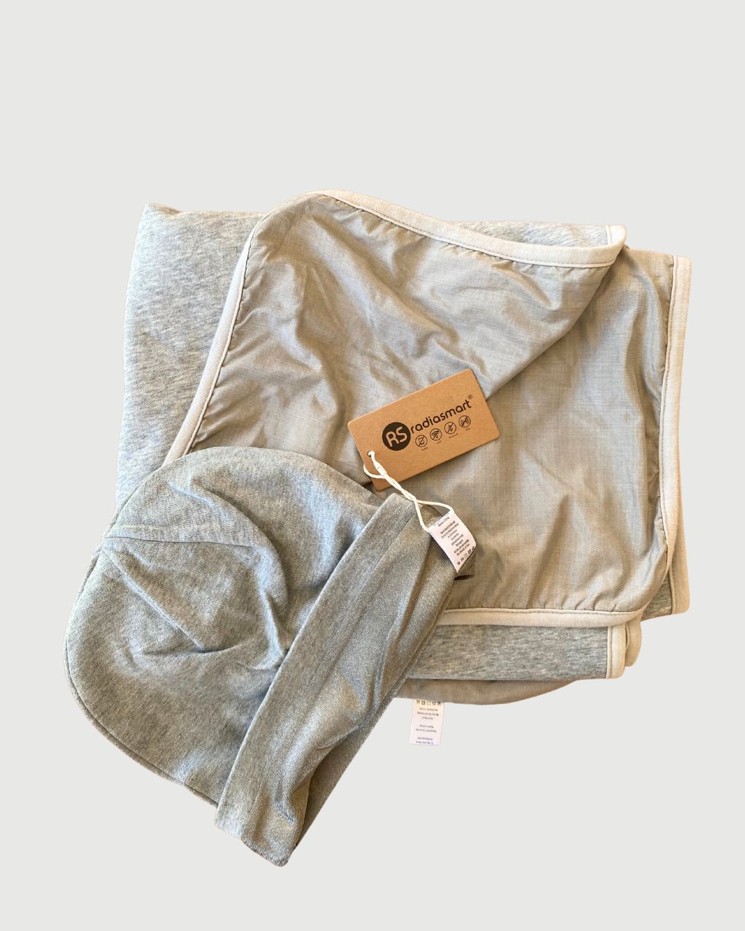 Embrace wellness with the Radia Smart® BUNDLE DEAL EMF Protection Poncho and Slouch Beanie in Grey. Silver-lined with Faraday fabric, this set blocks EMF, RF, and 5G radiation, supporting fertility and overall health. Made from soft, breathable materials, the poncho and beanie offer stylish comfort and powerful shielding. Perfect for daily wear, this bundle provides peace of mind and protection from modern wireless exposure.