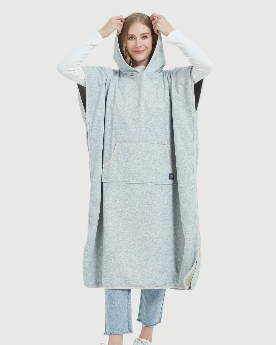 Radia Smart® Adult Hooded Poncho Blanket in Grey offers stylish, full-body comfort with built-in wellness protection. Silver-lined fabric provides advanced shielding against EMF, RF, and 5G radiation, acting as a wearable Faraday cage. Ideal for home, travel, or outdoor use, this hooded poncho combines cozy design with smart technology to help reduce exposure to harmful wireless signals. One-size-fits-most for adults.