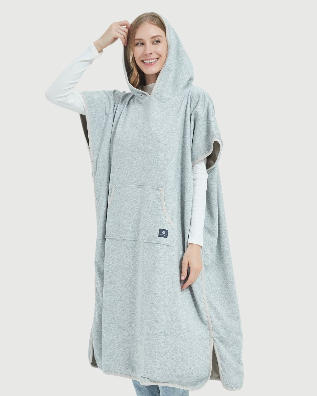Radia Smart® Adult Hooded Poncho Blanket in Grey offers stylish, full-body comfort with built-in wellness protection. Silver-lined fabric provides advanced shielding against EMF, RF, and 5G radiation, acting as a wearable Faraday cage. Ideal for home, travel, or outdoor use, this hooded poncho combines cozy design with smart technology to help reduce exposure to harmful wireless signals. One-size-fits-most for adults.