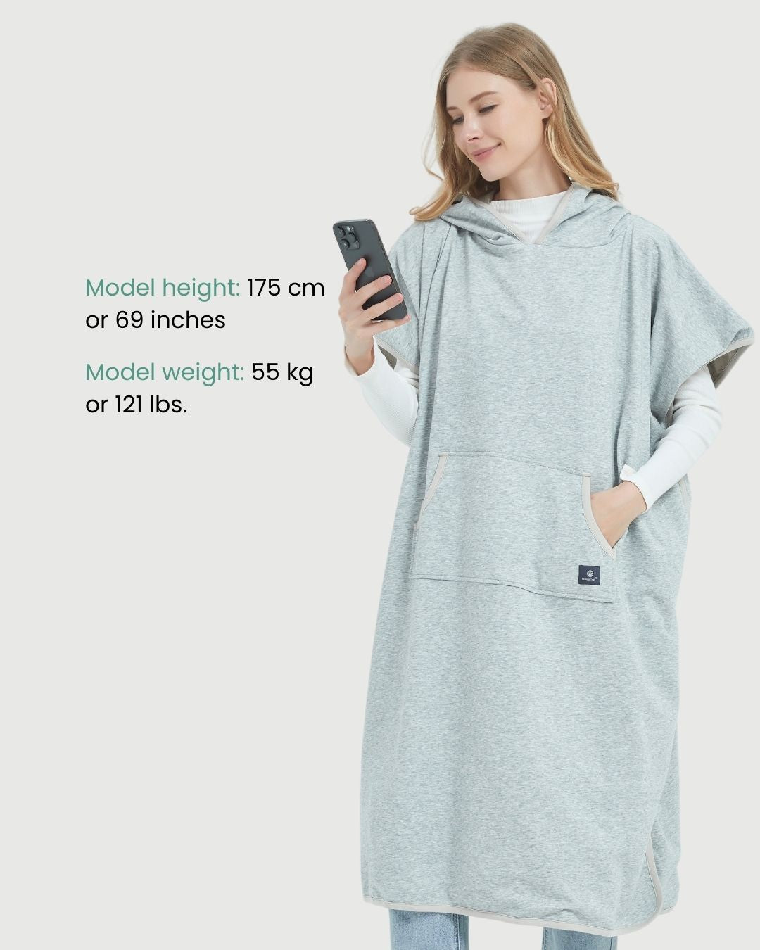 Radia Smart® Adult Hooded Poncho Blanket in Grey offers stylish, full-body comfort with built-in wellness protection. Silver-lined fabric provides advanced shielding against EMF, RF, and 5G radiation, acting as a wearable Faraday cage. Ideal for home, travel, or outdoor use, this hooded poncho combines cozy design with smart technology to help reduce exposure to harmful wireless signals. One-size-fits-most for adults.