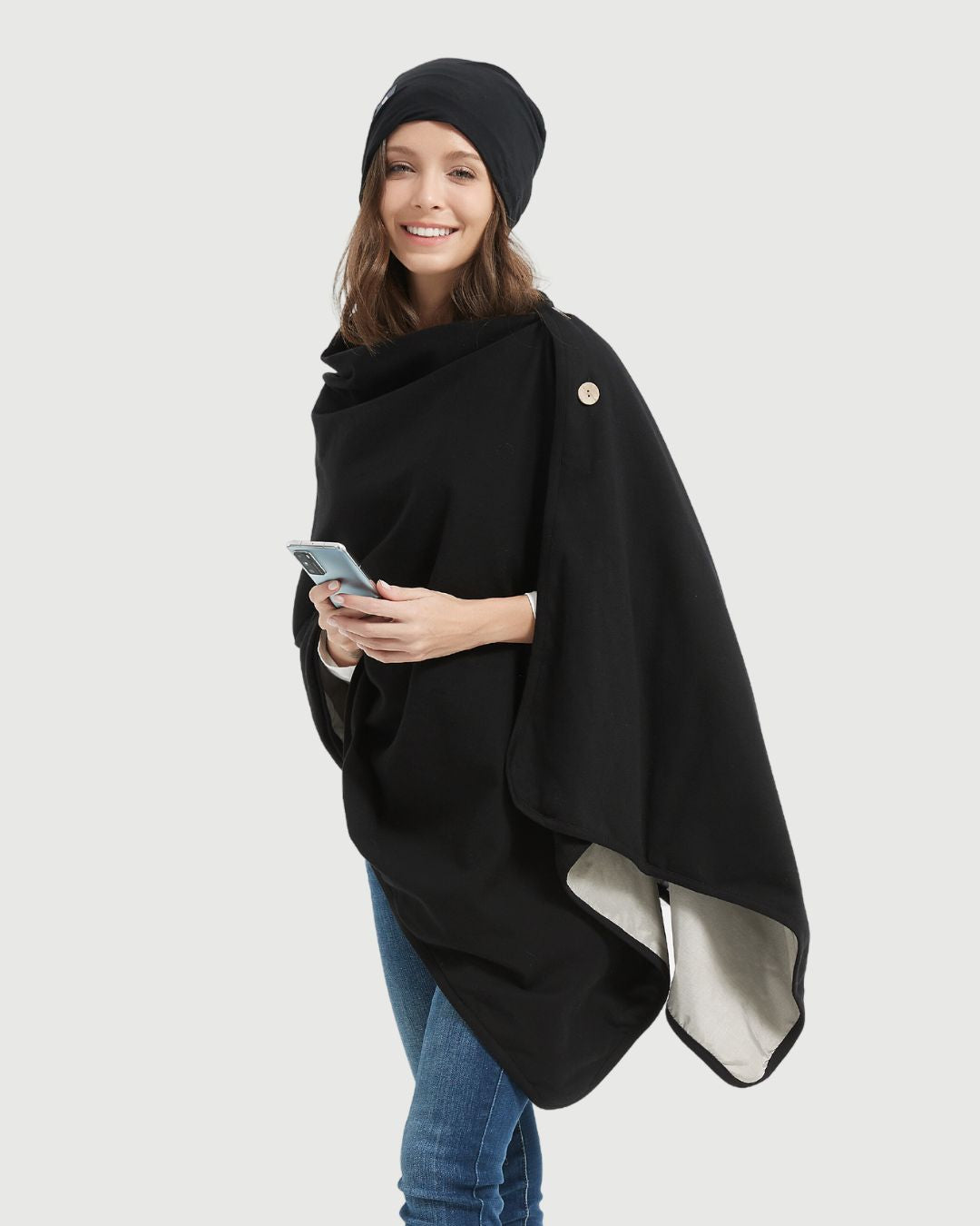 Embrace wellness with the Radia Smart® BUNDLE DEAL EMF Protection Poncho and Slouch Beanie in Black. Lined with silver Faraday fabric, this set blocks EMF, RF, and 5G radiation to support fertility and overall health. Made from soft, breathable materials, the poncho and beanie offer stylish comfort and effective shielding. Ideal for daily wear, this bundle helps reduce wireless exposure while keeping you cozy, protected, and fashion-forward.