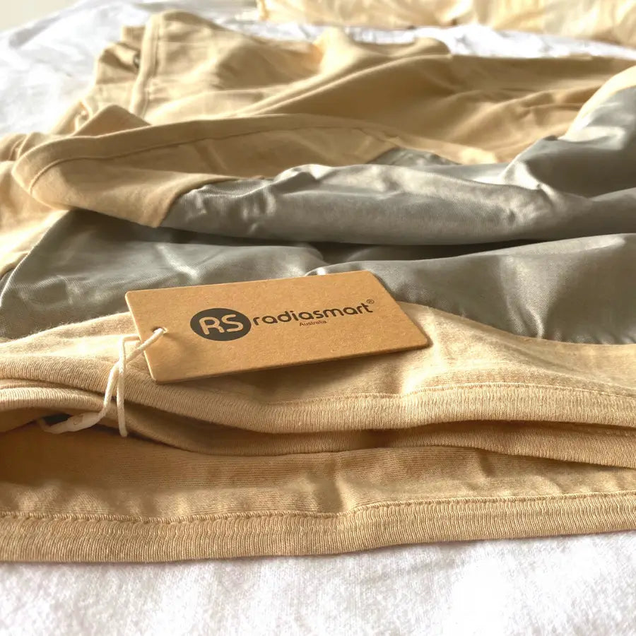 Stay cozy and protected with the Radia Smart® Classic XL Organic Cotton Bed Blanket. Crafted with silver-lined Faraday fabric, it provides powerful EMF protection by shielding against RF and 5G radiation. This extra-large, breathable, and soft blanket supports restful sleep and overall wellness. Ideal for daily use, it offers full-body coverage and reduces exposure to wireless signals in a natural, organic, and comfortable design.