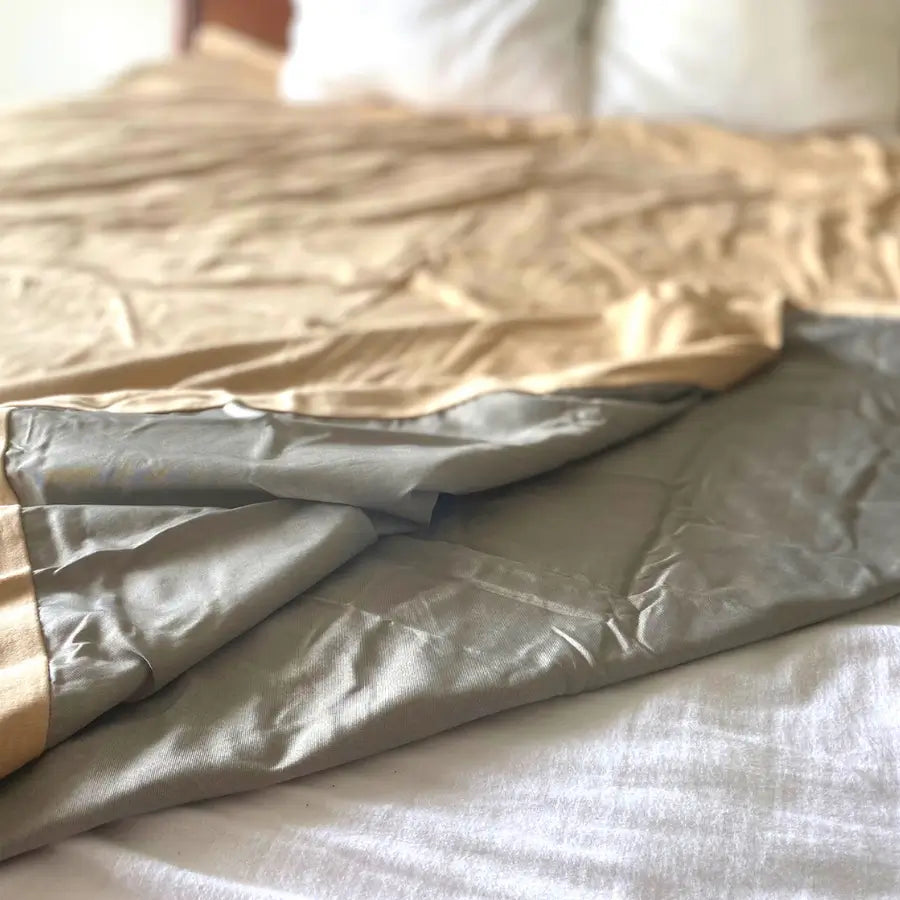 Stay cozy and protected with the Radia Smart® Classic Mega/XL Size Bed Blanket. Made from 100% cotton and silver-lined Faraday fabric, it blocks EMF, RF, and 5G radiation for a safer sleep environment. This breathable, soft bed blanket doubles as a bed sheet, offering full-body coverage and comfort while reducing wireless exposure. Ideal for promoting restful sleep and overall wellness in today’s connected world.