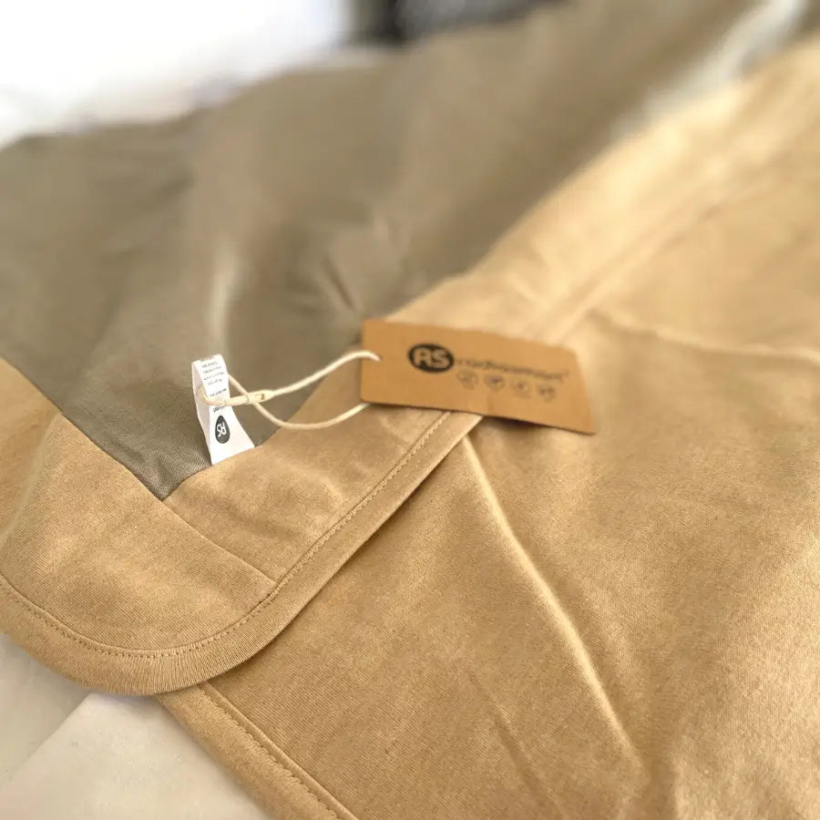 Stay cozy and protected with the Radia Smart® Classic XL Organic Cotton Bed Blanket. Crafted with silver-lined Faraday fabric, it provides powerful EMF protection by shielding against RF and 5G radiation. This extra-large, breathable, and soft blanket supports restful sleep and overall wellness. Ideal for daily use, it offers full-body coverage and reduces exposure to wireless signals in a natural, organic, and comfortable design.
