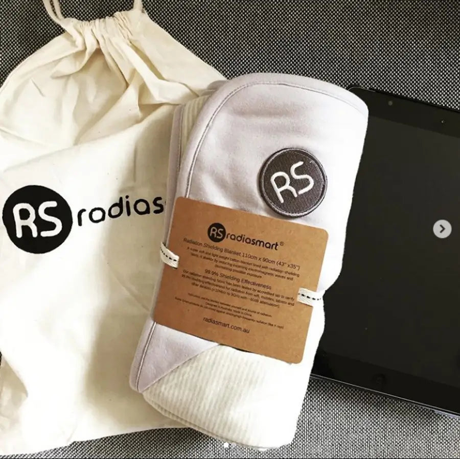Embrace wellness with the Radia Smart® Natural Organic Blanket (Large), designed for EMF protection and anti-radiation support. This silver-lined Faraday blanket helps shield against wireless radiation and supports fertility health. Made with certified organic cotton, it’s soft, breathable, and ideal for everyday use at home, during pregnancy, or while traveling. A natural, chemical-free solution for EMF-sensitive individuals and families.