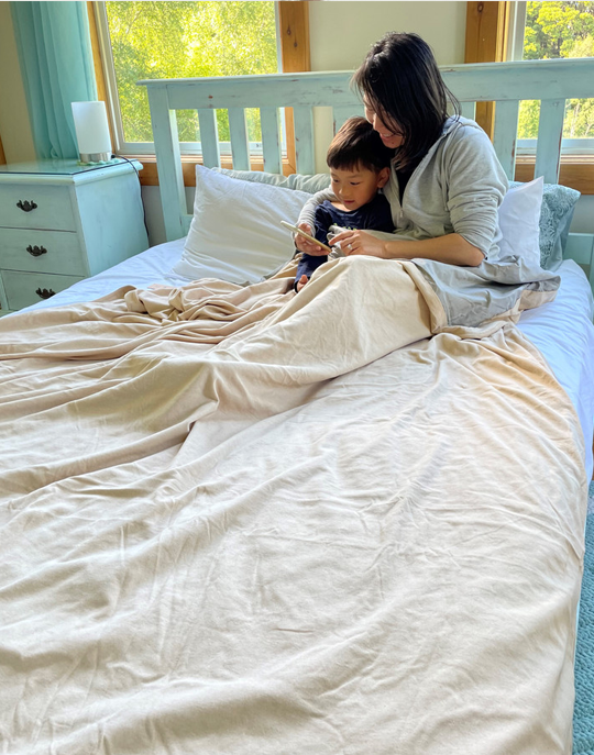 Stay cozy and protected with the Radia Smart® Classic Mega/XL Size Bed Blanket. Made from 100% cotton and silver-lined Faraday fabric, it blocks EMF, RF, and 5G radiation for a safer sleep environment. This breathable, soft bed blanket doubles as a bed sheet, offering full-body coverage and comfort while reducing wireless exposure. Ideal for promoting restful sleep and overall wellness in today’s connected world.