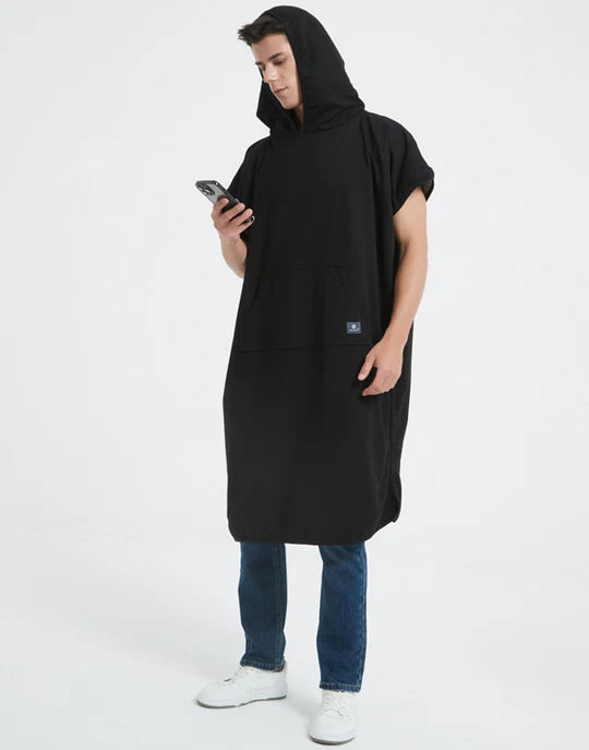 Radia Smart® Adult Hooded Poncho Blanket in black offers stylish, full-body comfort with built-in wellness protection. Silver-lined fabric provides advanced shielding against EMF, RF, and 5G radiation, acting as a wearable Faraday cage. Ideal for home, travel, or outdoor use, this hooded poncho combines cozy design with smart technology to help reduce exposure to harmful wireless signals. One-size-fits-most for adults.